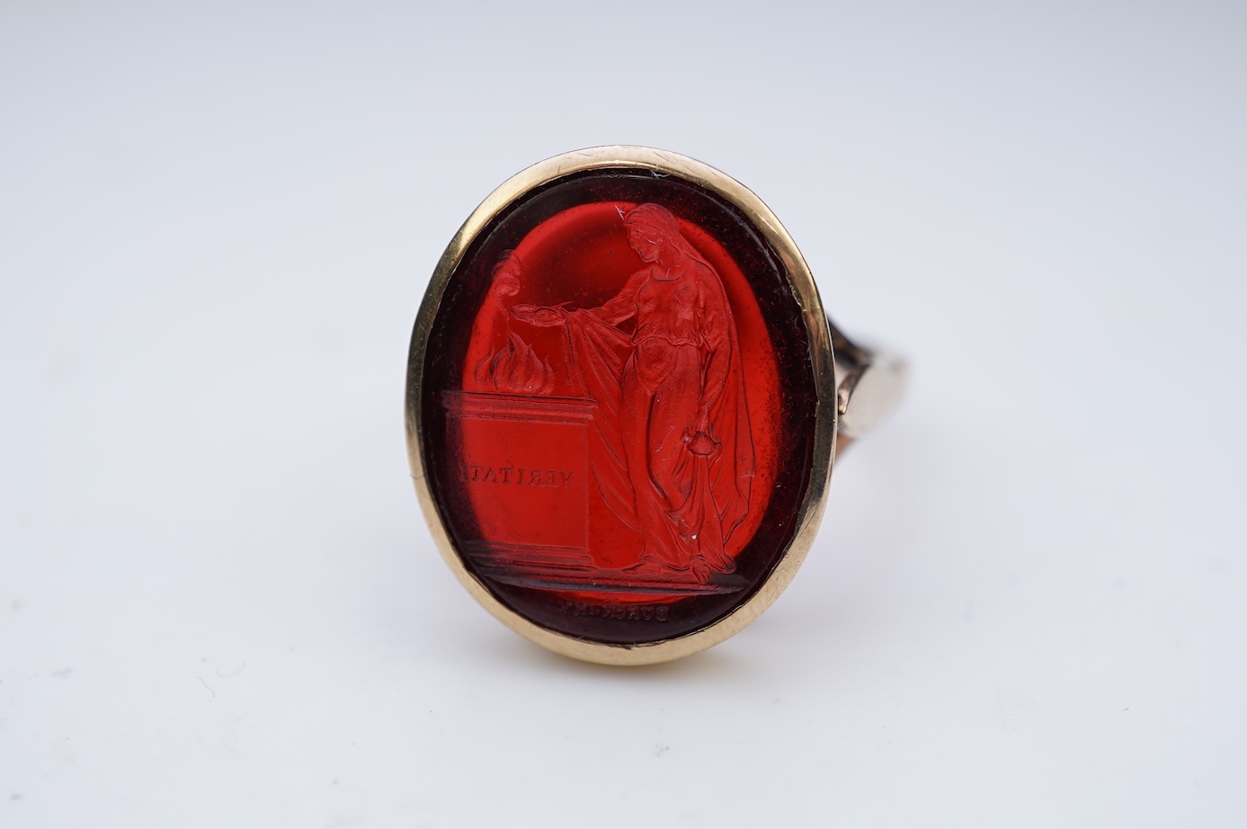 A glass intaglio ring, early 20th century
